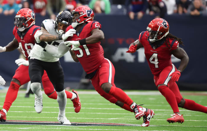 Texans defensive end Will Anderson Jr. is blocked by Jacksonville Jaguars tight end Evan Engram (17) in the second half at NRG Stadium